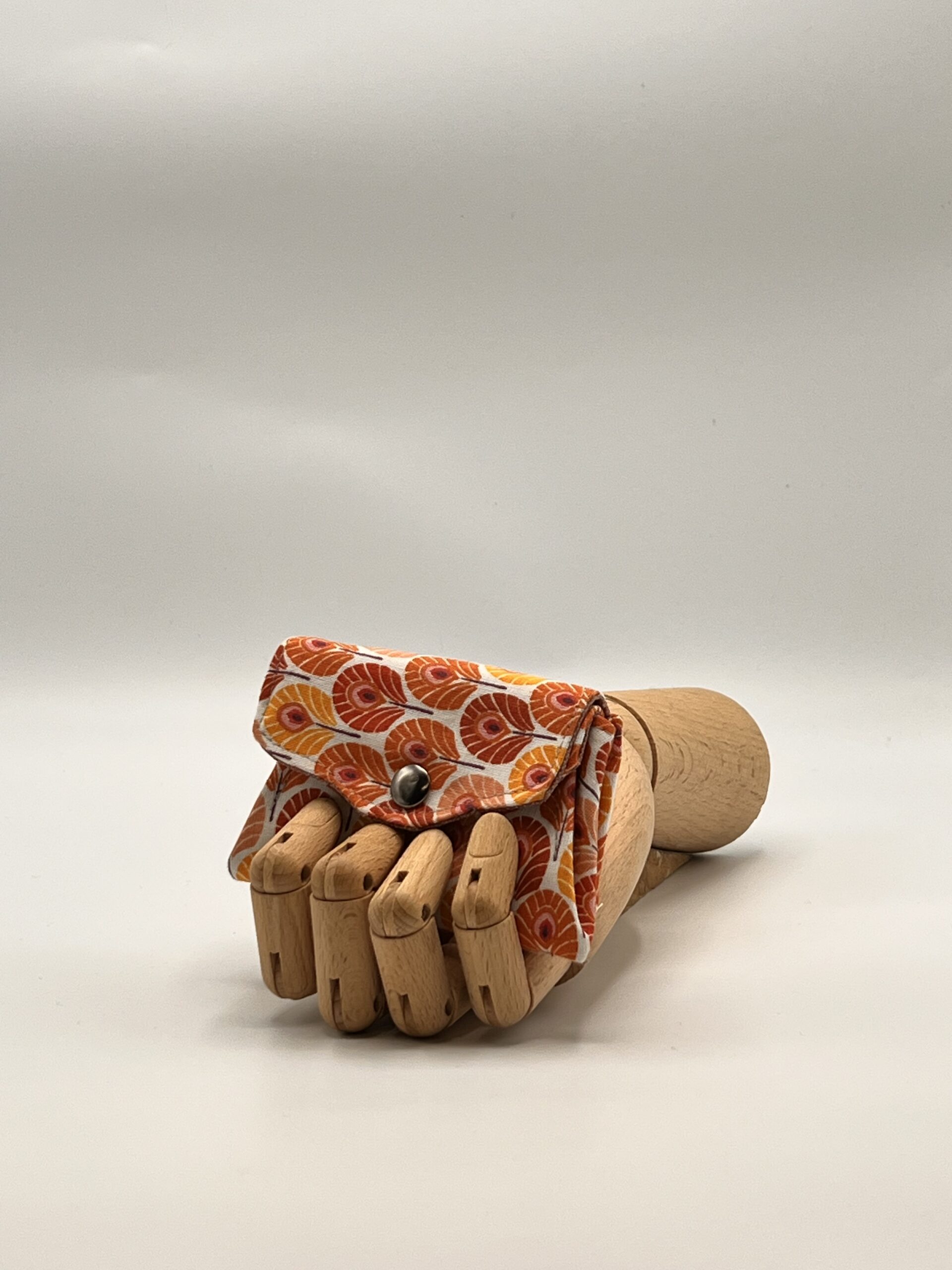 Monedero APONI-pluma naranja.