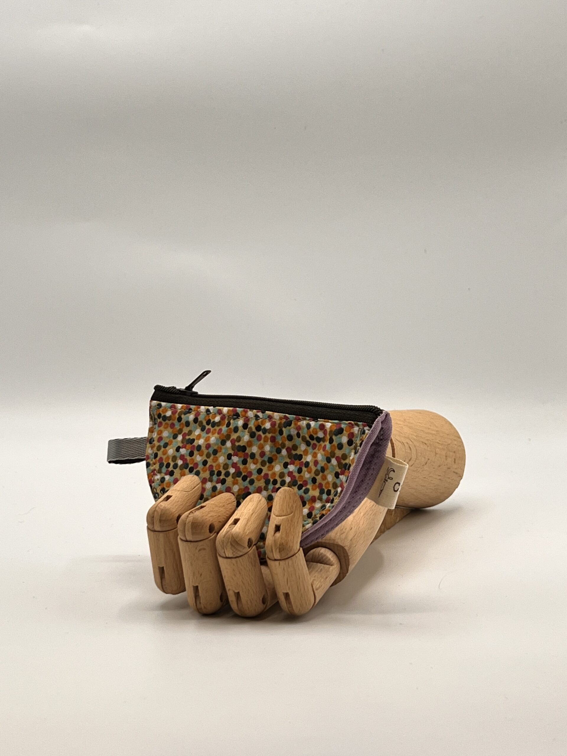 Monedero LIRA-topos de colores.