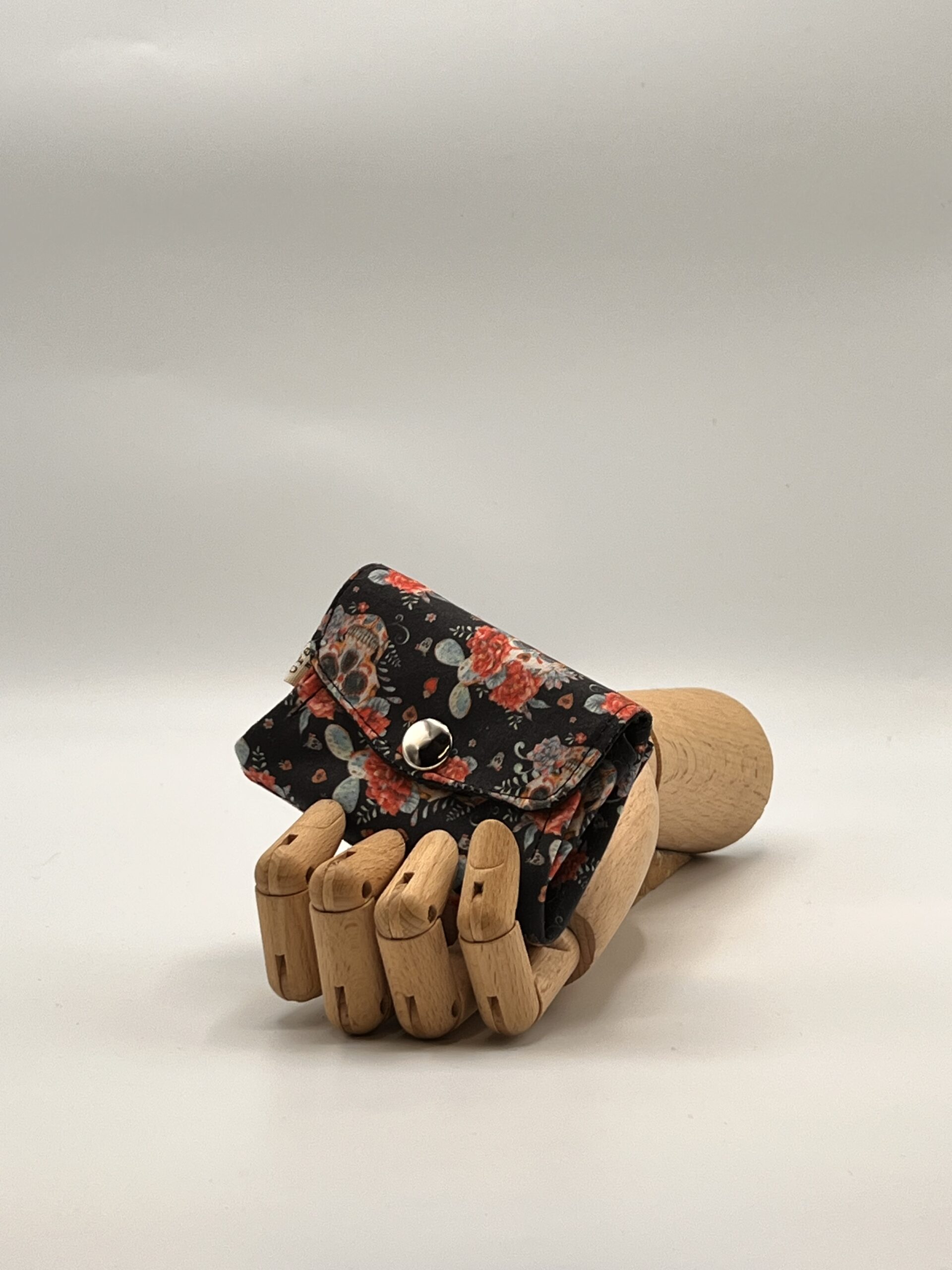 Monedero APONI-catrinas rosas.